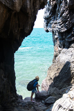 Travel women in a cave near the sea in Keo Sichang, Thailand