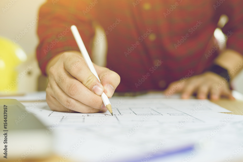 Aufkleber close up of engineers hands working on table with pencil,engineer meeting for architectural project.