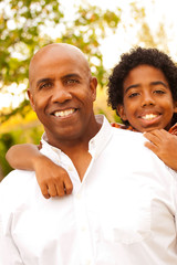 Fototapeta premium African American father and son talking and laughing.