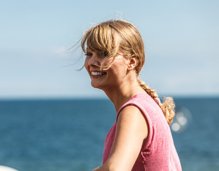 Woman relaxing by sea ocean outdoor.