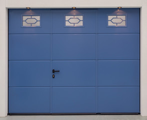 the facade of the garage with metal gates blue color