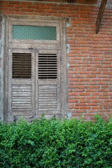 Ancient wooden window A craftsman of old-fashioned carpentry.