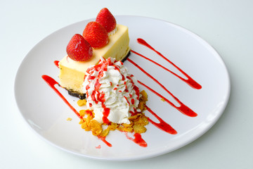 strawberry topping delicious cake with whip cream and strawberry sauce serve on white plate