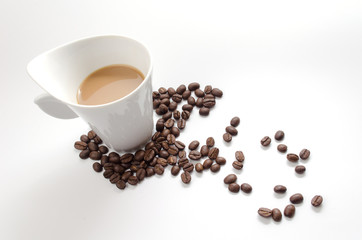 coffee beans and white coffee cup isolated on white background