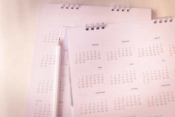 Blurred calendar on white texture.
