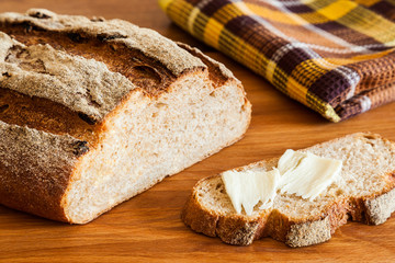 Rustic bread with bran close-up. Healthy whole wheat bread with crispy crust