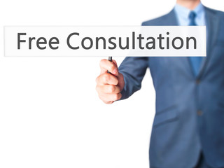 Free Consultation - Businessman hand holding sign