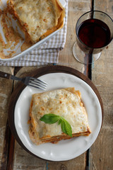 Lasagna Bolognese on a rustic table