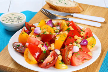 chickpeas, tomatoes slice, red onion salad