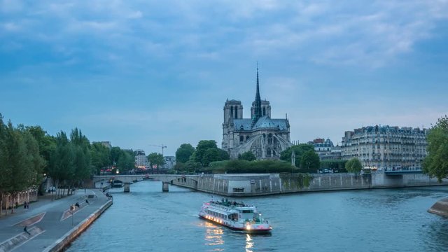 Paris city skyline day to night timelapse at Notre Dame de Paris Cathedral and Seine River, Paris, France, 4K Time lapse