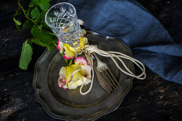 Summer table setting with roses