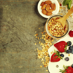 Healthy Breakfast set with granola, honey, almond milk and berries