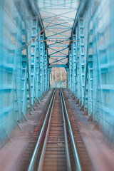 Railway bridge against white mountains