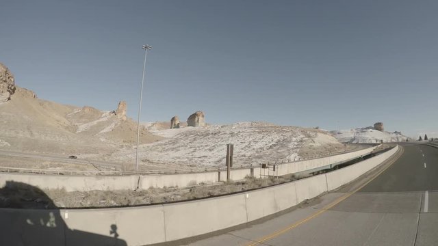 Dashcam Footage from an Elevated position on a Rural Highway in the US State of Wyoming During Winter.