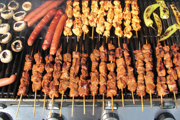 Barbecue. Shish kebab, with grilled peppers and mushroom on hot grill.