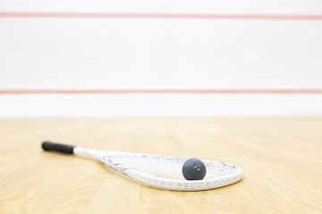 racket and ball for squash game