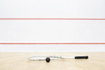 racquetball equipment and wall with red lines