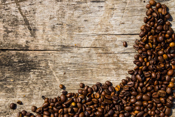 Coffee beans on wooden background