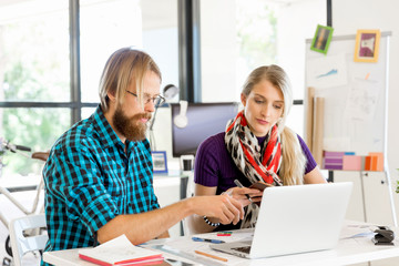 Two office workers at the desk