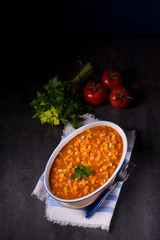 fish with vegetables in tomato sauce