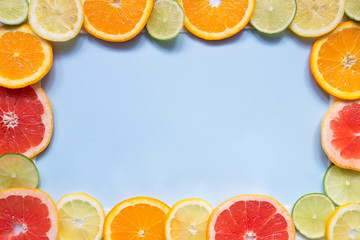 Citrus background with copy space. Citrus fruits on the blue background with copy space. Top view