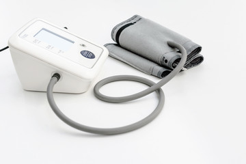 Digital Blood Pressure Monitor on white background.