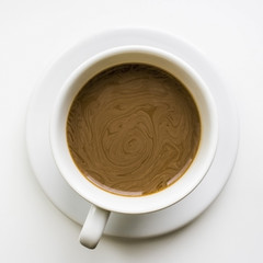A cup of coffee with milk on a white background