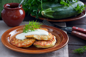Freshly cooked fried fritters from zucchini and cottage cheese, horizontal