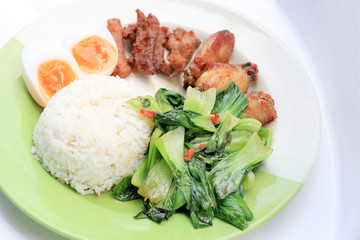 stir fried vegetables, Hard-boiled egg, Fried pork and Fried chicken wings with thai jasmine rice...