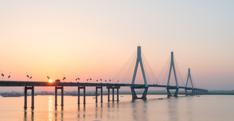 cable stayed bridge with setting sun