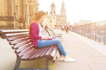 girl writes in the diary the impression of the tourist on Dresden