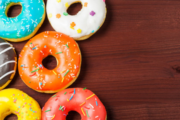 Donuts on a wooden background. Junk food. Fast food.