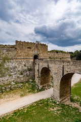 Fototapeta premium Gate of Saint John, bridge leading to it and moat at Rhodes old town, Greece 