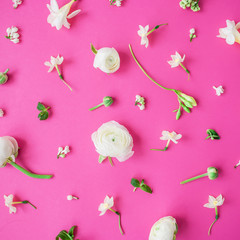 Floral pattern of white flowers and buds on pink background. Flat lay, top view. Summer background.