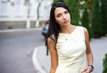 portrain of the beautiful young woman with yellow dress