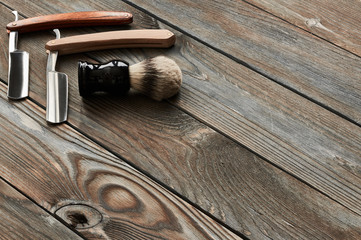 Vintage barber shop tools on wooden background