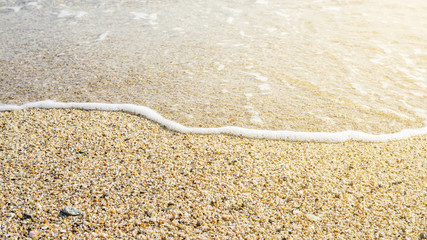 Sand beach and soft wave for a background.