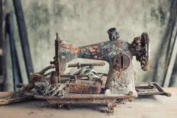 The old ruins sewing machine at the Kaliadem village nearest Merapi mount, Yogyakarta, Java, Indonesia. (Vintage tone)