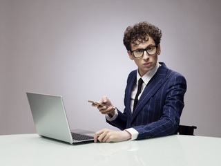 Funny businessman with laptop