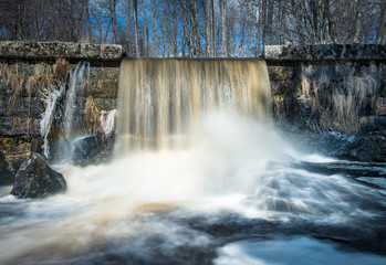 Closeup view of little waterfall on the river