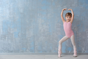 Fototapeta premium Cute little ballerina in dance studio