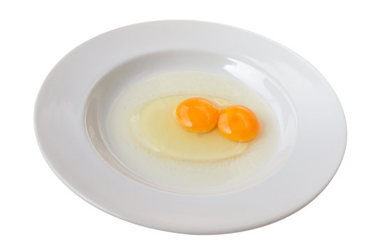 Twin eggs in a white dish. Isolated on white background. (with clipping path)