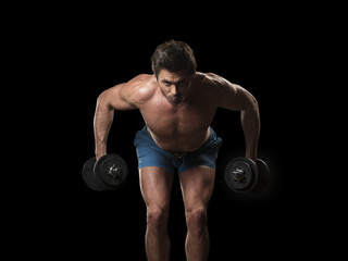 Fototapeta na wymiar Muscular man with dumbbells