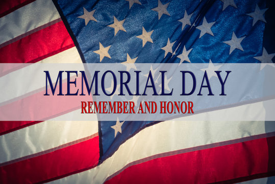 Text Memorial Day and Honor on flowing American flag background. Concept of Memorial day or Veteran's day in America.