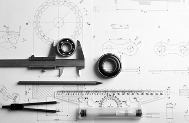 Engineering supplies and blueprints on workplace