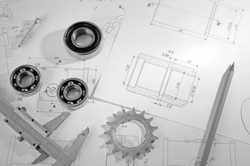 Engineering supplies and blueprints on workplace