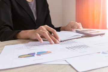 Businesswomen working with graph data at office,Finance managers task,Concept business and finance