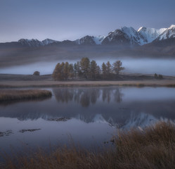 Misty autumn morning, a picturesque mountain lake