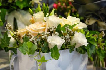 Beautiful bouquet of white festive flowers in packaging box, closeup