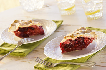 Two Slices of Summer Berry Pie with Drinks